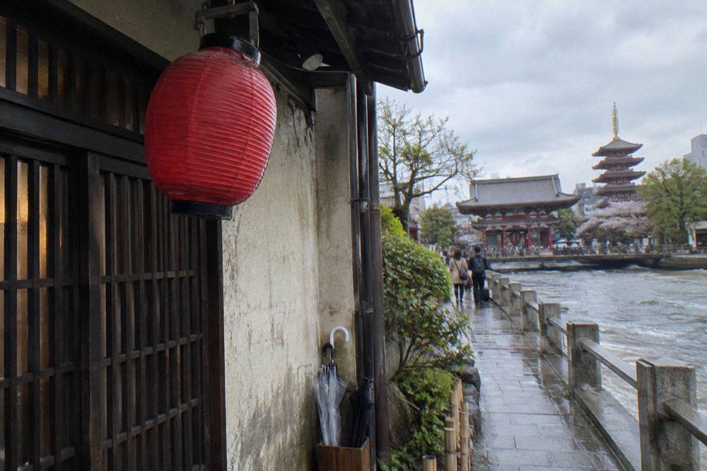 Red paper lantern hanging outside a small traditional restaurant entrance